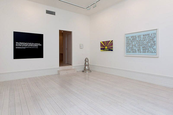 From Left: Joseph Kosuth, Andy Warhol quote, 1968, Mounted photograph, 48 x 48 inches, (121.92 x121.92 cm); Paul McCarthy, Stainless Steel Butt Plug, 2007, Polished stainless steel, 35 x 22 x 16 inches, (88.9 x 55.9 x 40.6 cm); Roy Lichtenstein, Sunrise, 1965, Porcelain enamel on steel, 22.5 x 36 inches, (57.2 x 91.4 cm); Richard Prince, My Wife, My Wife, 2004, Cancelled checks and acrylic on canvas, 35.5 x 48 inches (90 x 120 cm)