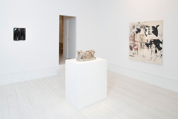 Left to right: Daniel Turner, 5150 (1/10/12), 2012, bitumen emulsion, vinyl and wood, 16.5 x 14 x 1.5 in (41.9 x 35.56 x 3.81 cm); Rosemarie Trockel, Not Yet Titled, 2007, ceramic and platinum glaze, 11.13 x 22.5 x 10.25 in (28 x 57 x 26 cm); Nate Lowman, Open Container, 2012, resin, red wine, dirt, spray paint and polymer on canvas, 60 x 47 in (142.2 x 119.4 cm)